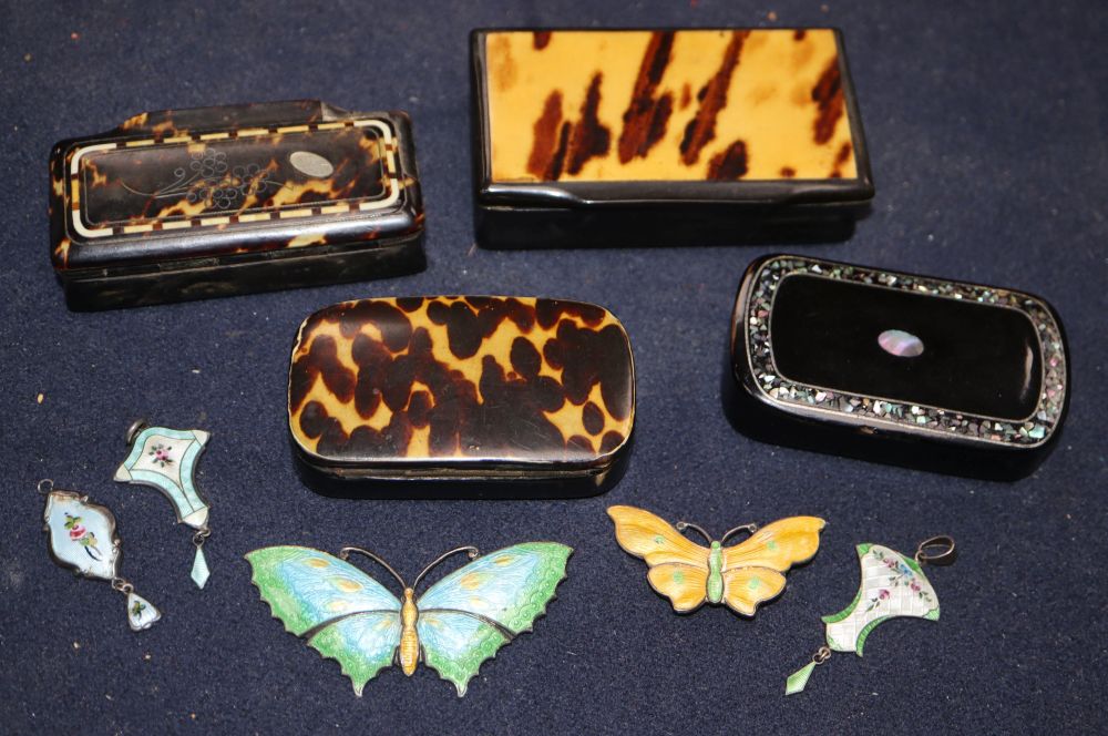 Four 19th century papier mache snuff boxes, two enamelled silver butterfly brooches and three pendants